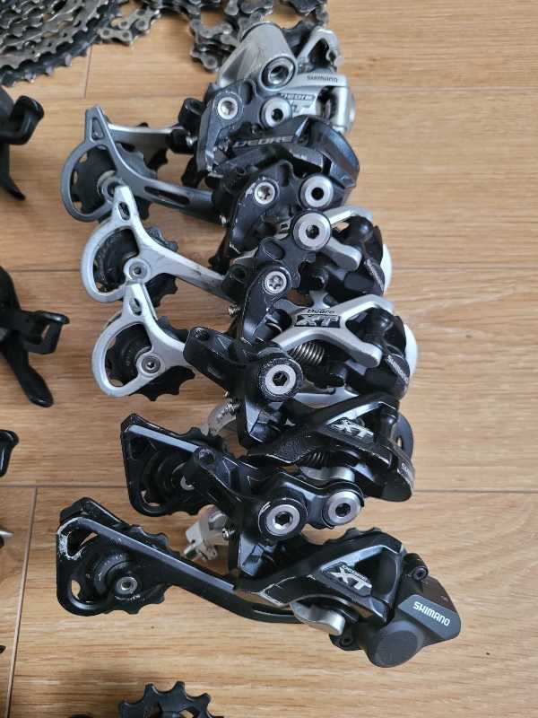 Манетки,  переключатели Shimano Deore XT,  SLX.