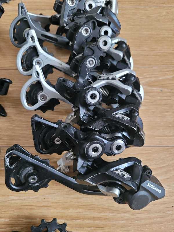Манетки,  переключатели Shimano Deore XT,  SLX.