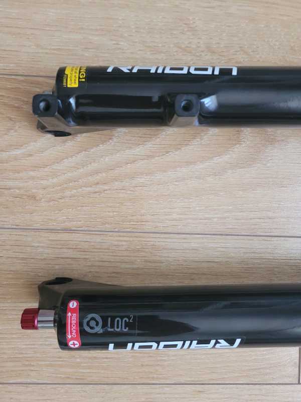 Вилка   SRSUNTOUR RAIDON AIR 27.5- 29., ось.